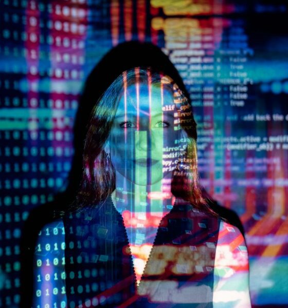 code projected over woman