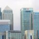 Modern skyline of Canary Wharf featuring iconic bank skyscrapers like HSBC and Barclays.